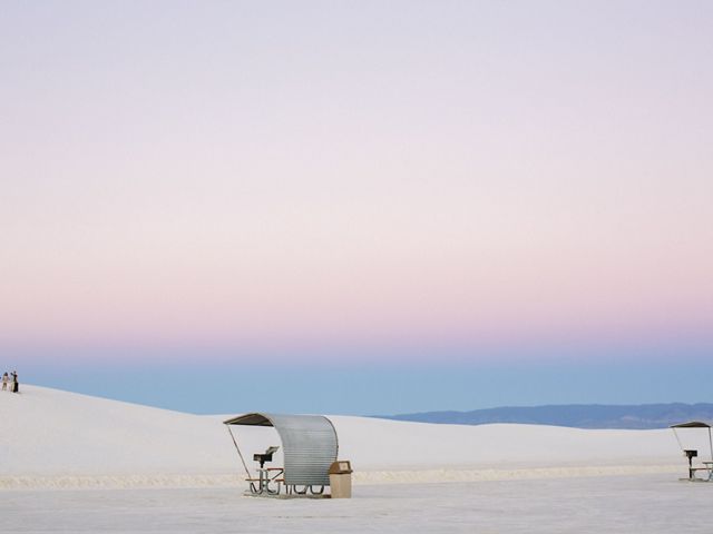 Picnic shelters at dusk at White Sands National Park, New Mexico.