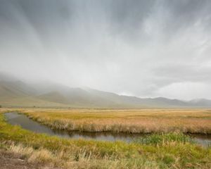 Ruby Lake with fog-covered mountains in the background.