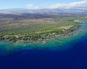 Aerial view of the Puakō, Hawai‘i coastline showing the coral reef that spans the length of the entire coast.